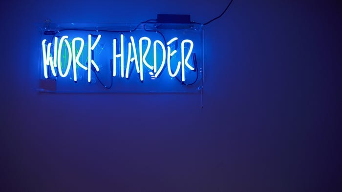 A sign that says “work harder” A sign that says “work harder”