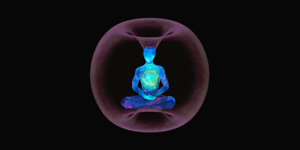 A faintly glowing human sitting in a meditation pose in the center of a toroidal field or torus. 