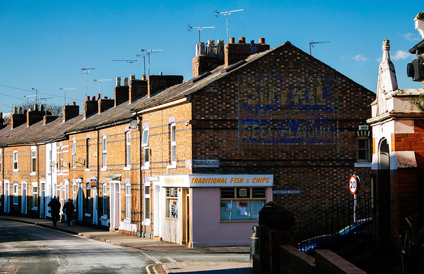 A row of British Edwardian terraced houses in a northern town