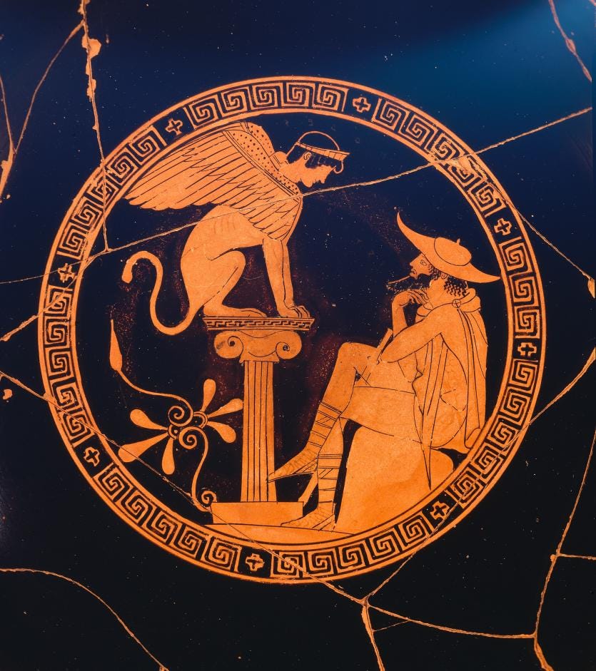 red figure vase showing oedipus sitting in a hat looking up at the sphinx