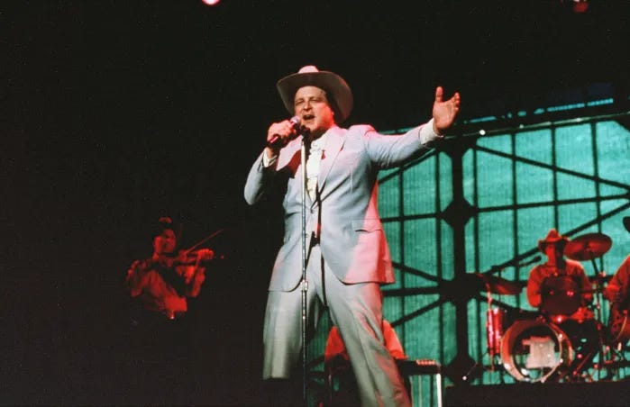 John Goodman singing on stage in the movie True Stories.