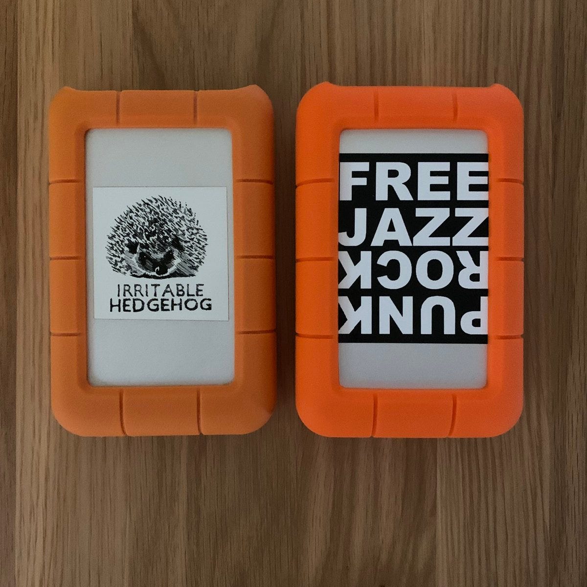 Two orange hard drives