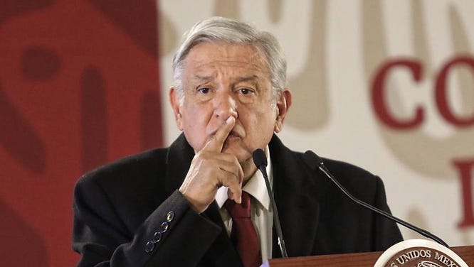 mexico president AMLO with finger on lips