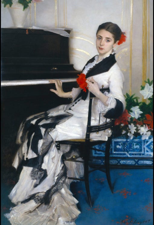 Madame Ramón Subercaseaux (1889). Amalia, Madame Subercaseaux wears a beautiful black and white costume with a soft waterfall train, made of lots of frills. A large red flower is stylishly pinned to the front of the bodice, which has a long line of small black buttons down it. Another red flower ornaments her smooth hair bun. One hand rests on the piano as though we’ve walked into the room, disturbed her playing and she’s swishily turned to speak to us.