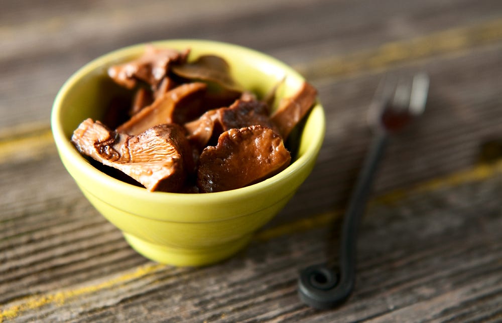 A bowl of pickled chanterelles.