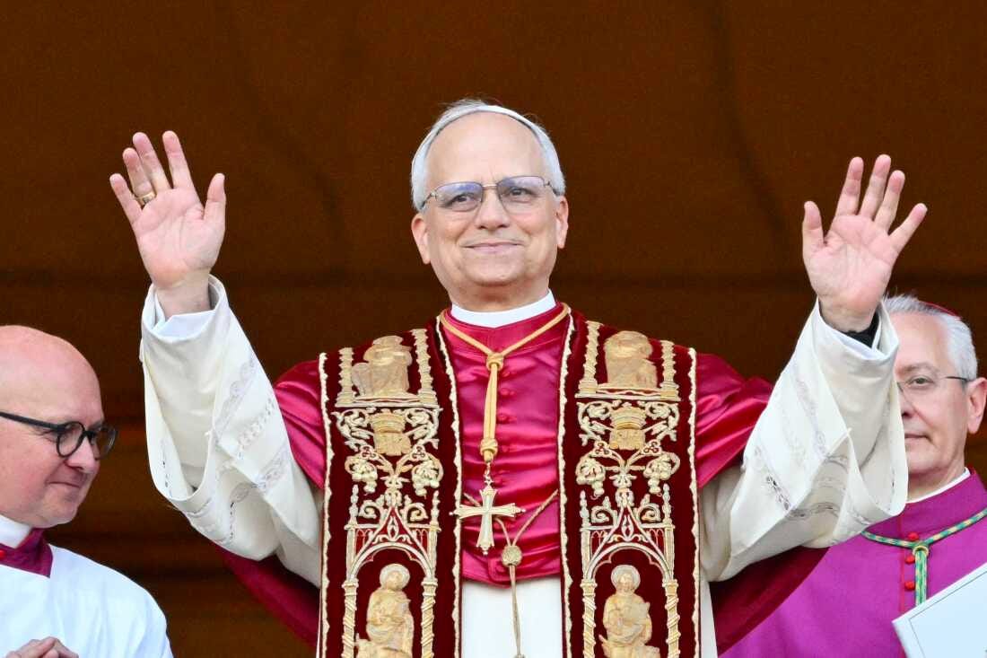 Pope Leo XIV arrives on the balcony of St. Peter's Basilica for the first time since he was elected pope.