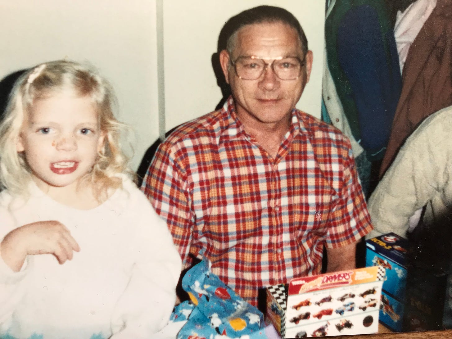 Amanda at young age with grandpa Harley