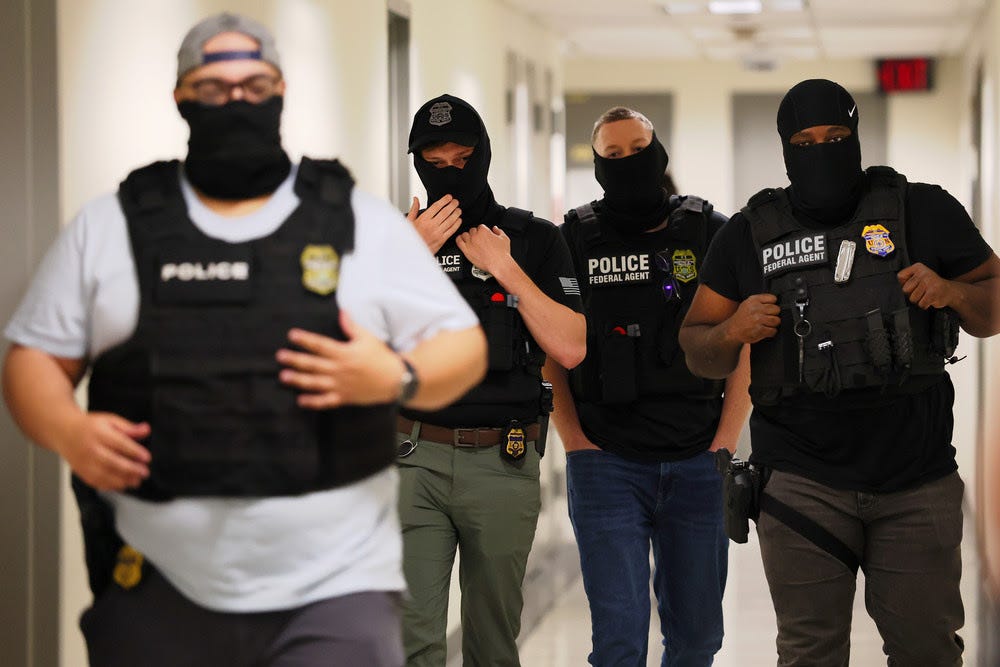 Federal agents patrol the halls of immigration court at the Jacob K. Javitz Federal Building in New York City. 