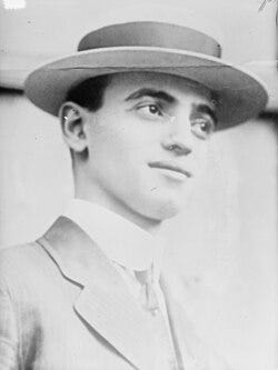 Black-and-white head shot of Frank facing slightly right