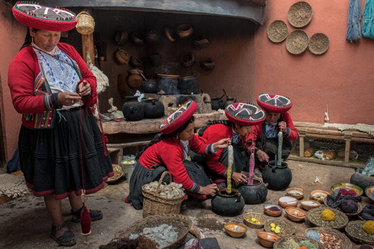 A group of women from a Quechan community spinning and dyeing fibers.