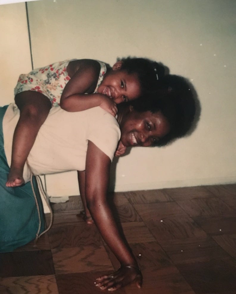 Me, at 3, on my Mommy's back, while we both smile widely