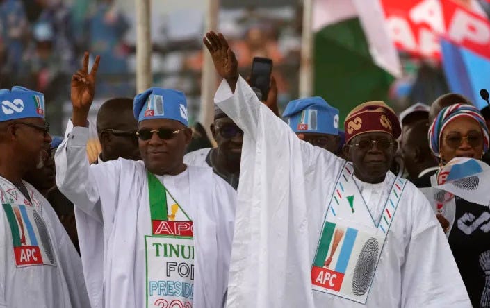 Bola Ahmed Tinubu, right, presidential candidate of the All Progressives Congress, Nigeria ruling party, greets his supporters during an election campaign rally at the Teslim Balogun stadium in Lagos Nigeria, Tuesday, Feb. 21, 2023. Fueled by high unemployment and growing insecurity, younger Nigerians are mobilizing in record numbers to take part in this month's presidential election. (AP Photo/Sunday Alamba)