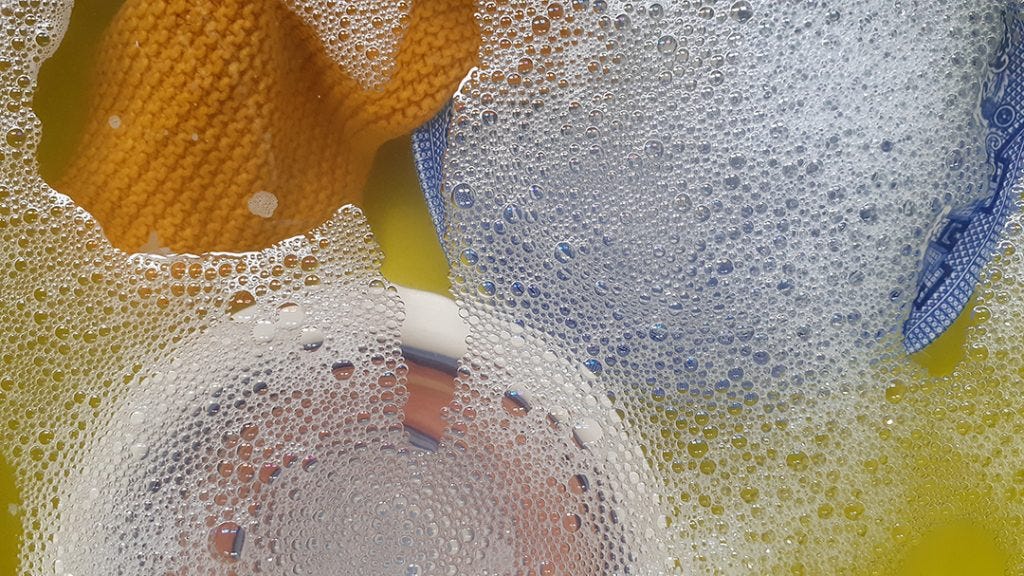 crockery in washing up bowl