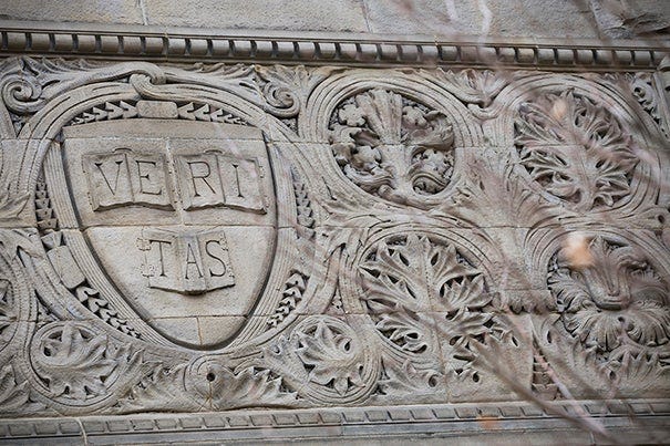 Harvard University has veritas shields on display in every corner of the campus. A veritas shield is pictured on the exterior of Austin Hall at Harvard Law School. Stephanie Mitchell/Harvard Staff Photographer