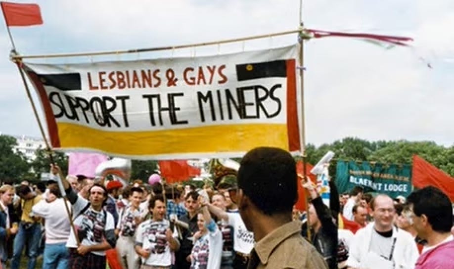 Marchers at Pride rally with an LGSM banner