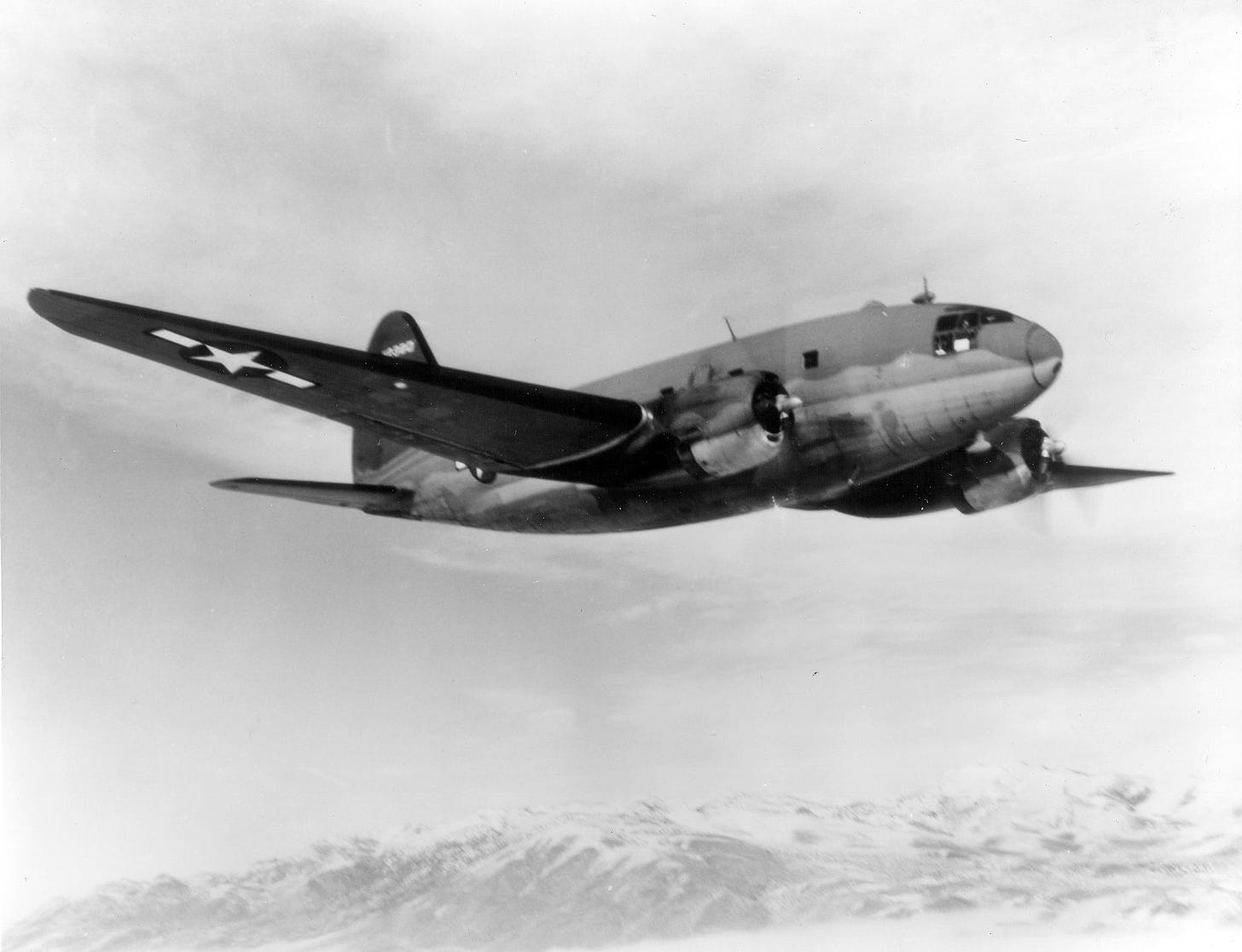 A C-46 Commando is pictured in the air; it's similar to the plane Cal Poly used 