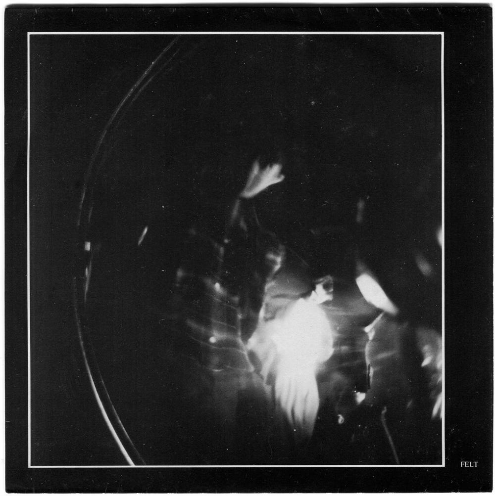 A-side sleeve of Felt’s single "My Face Is on Fire". It’s a blurry and indistinct black and white photo of the band.