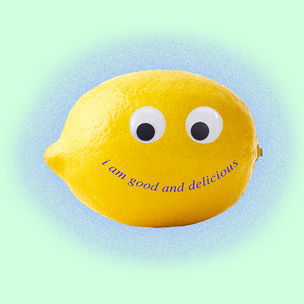 a lemon with googly eyes and a mouth that says I am good and delicious