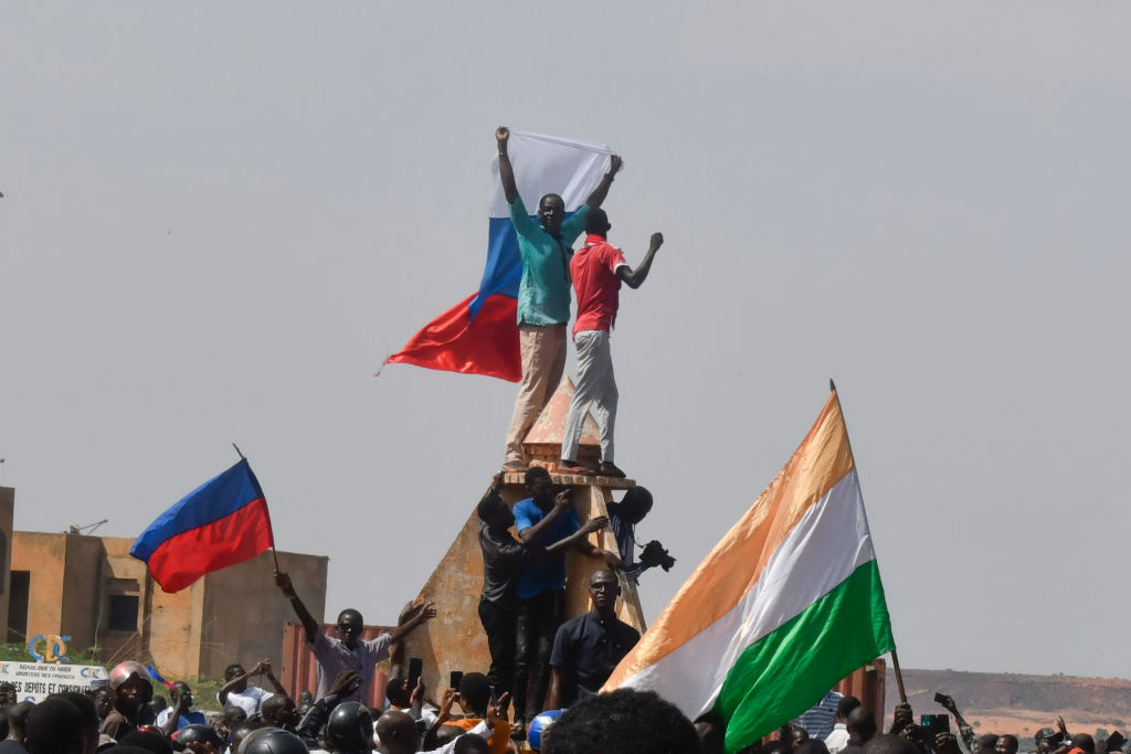 Protesters wave Nigerien and Russian flags as they gather during a rally in support of Niger's junta in Niamey on July 30, 2023.  (AFP via Getty Images)