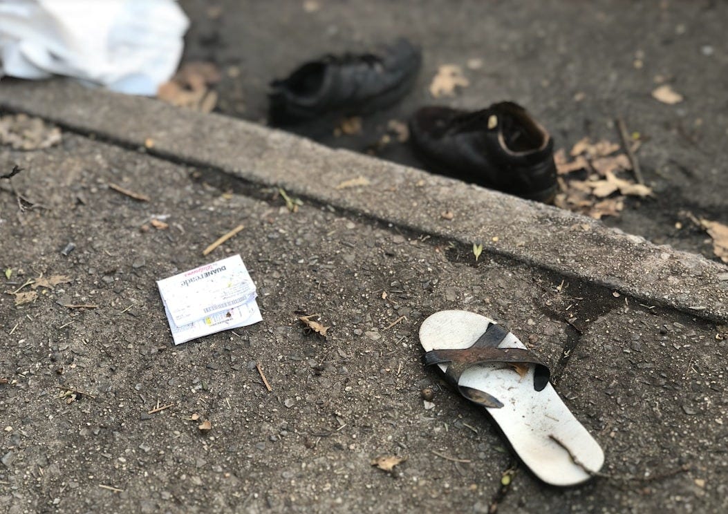 flip-flop on concrete pavement