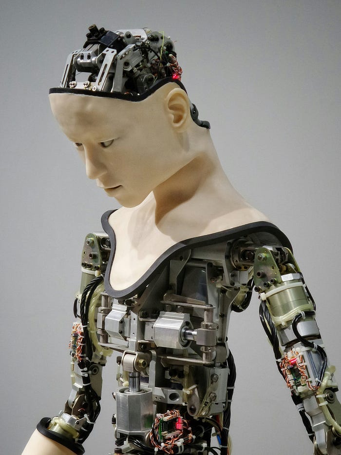 Robot with a human face and body.