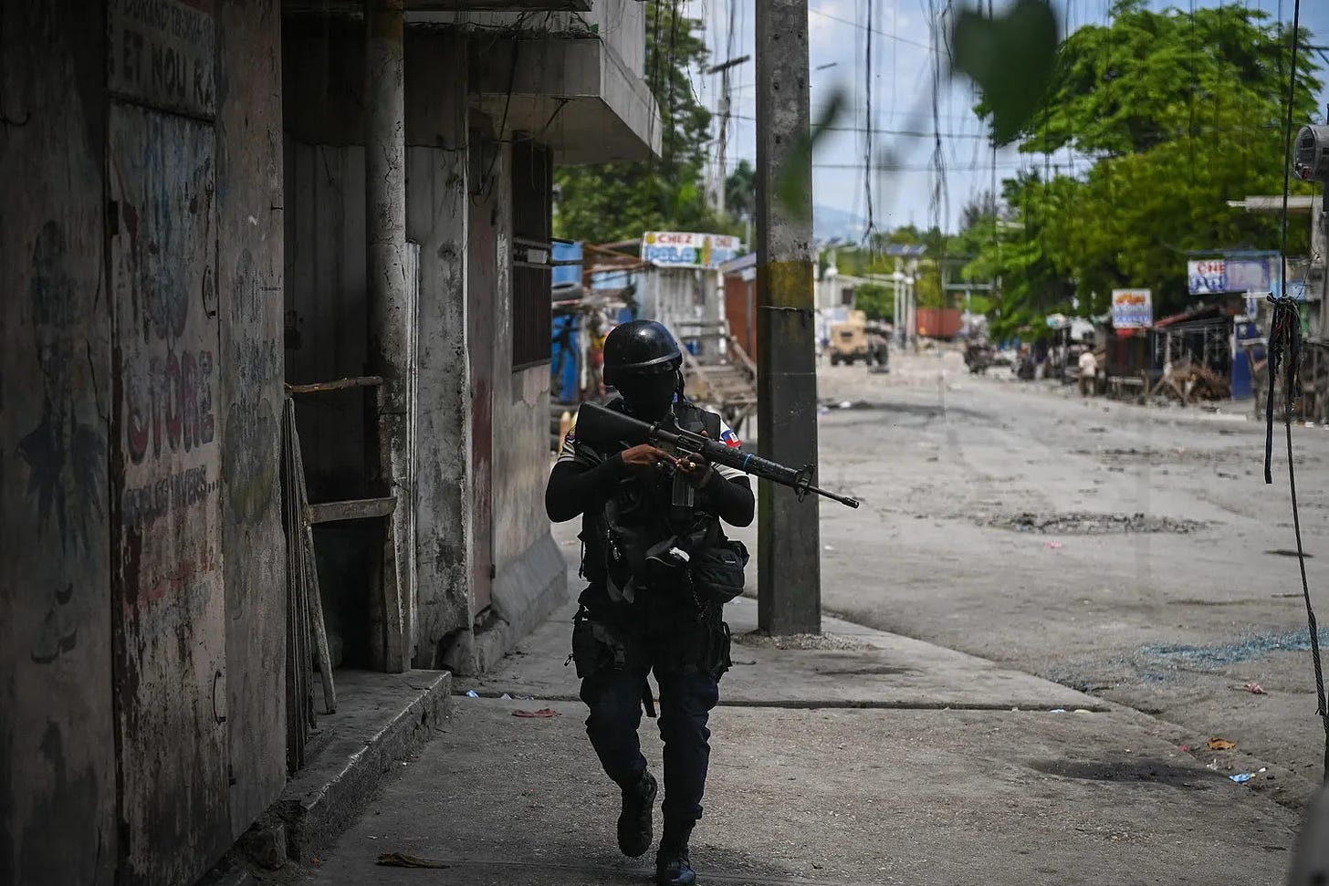 Police officers patrol a neighborhood in the Haitian capital of Port-au-Prince.