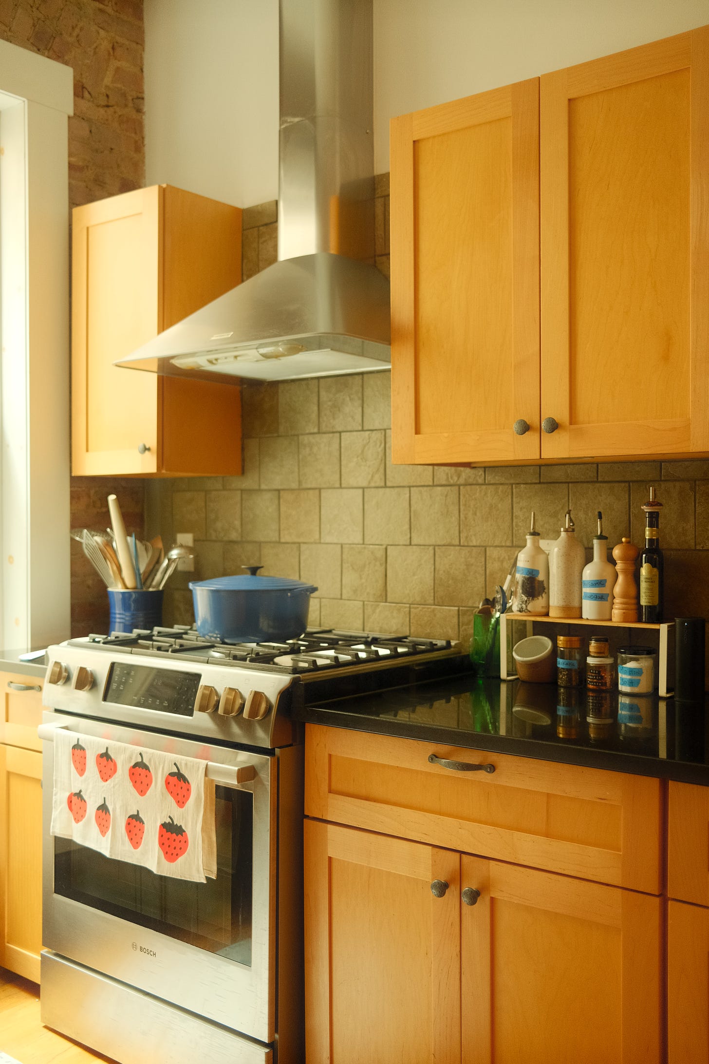 Kitchen with wooden cupboard doors.