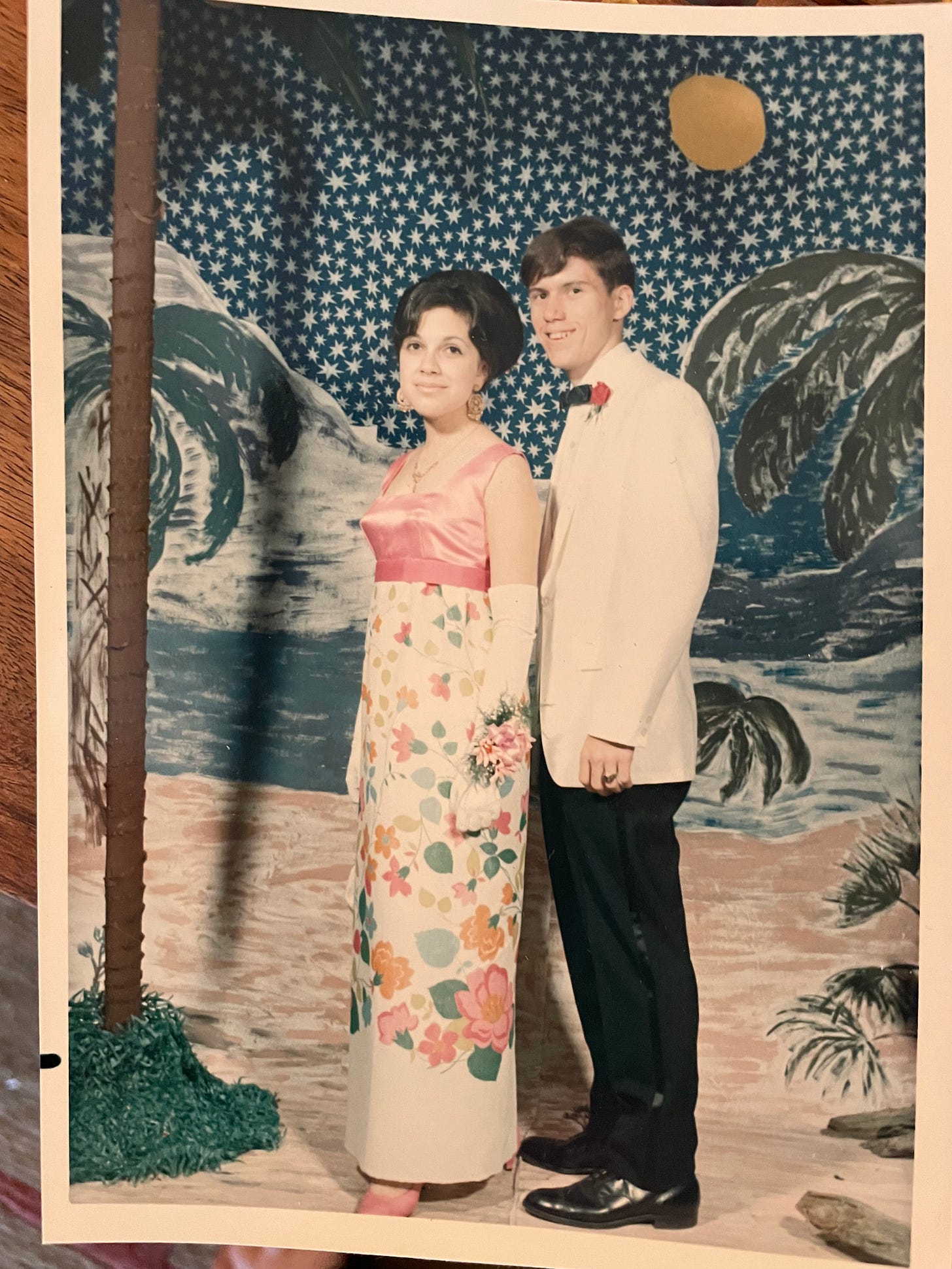 Teen couple posing for 60s prom photo