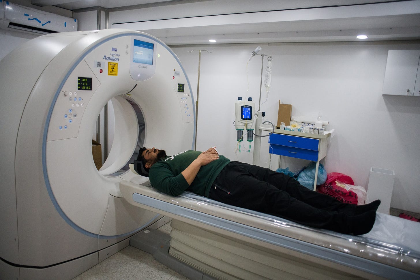 A patient receives a Magnetic Resonance Imaging (MRI) scan.