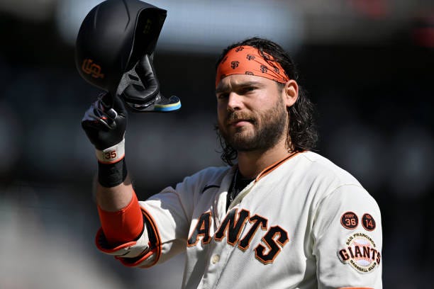 Brandon Crawford of the San Francisco Giants waves to the crowd at his final game against the Los Angeles Dodgers at Oracle Park on October 1, 2023...