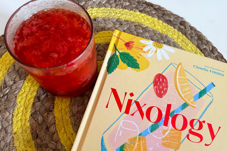 Balsamic strawberry fizz cocktail and a copy of recipe book 'Nixology'.