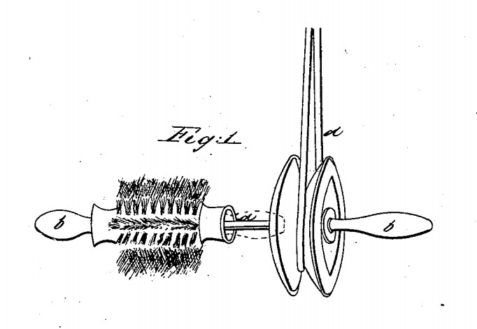 A simple drawing of a cylindrical brush attached to a pulley.