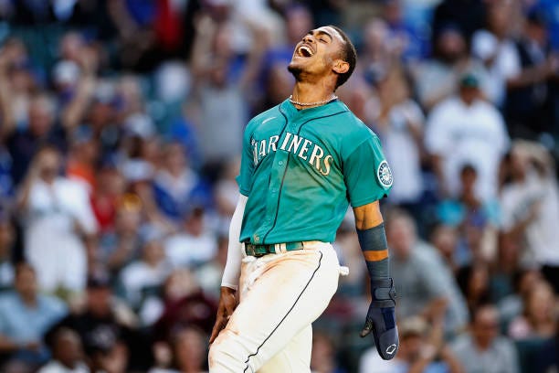 Julio Rodriguez of the Seattle Mariners scores a run during the third inning against the Toronto Blue Jays at T-Mobile Park on July 08, 2022 in...