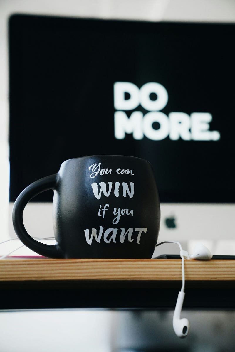 A cup with the words, “You can Win if you want”.