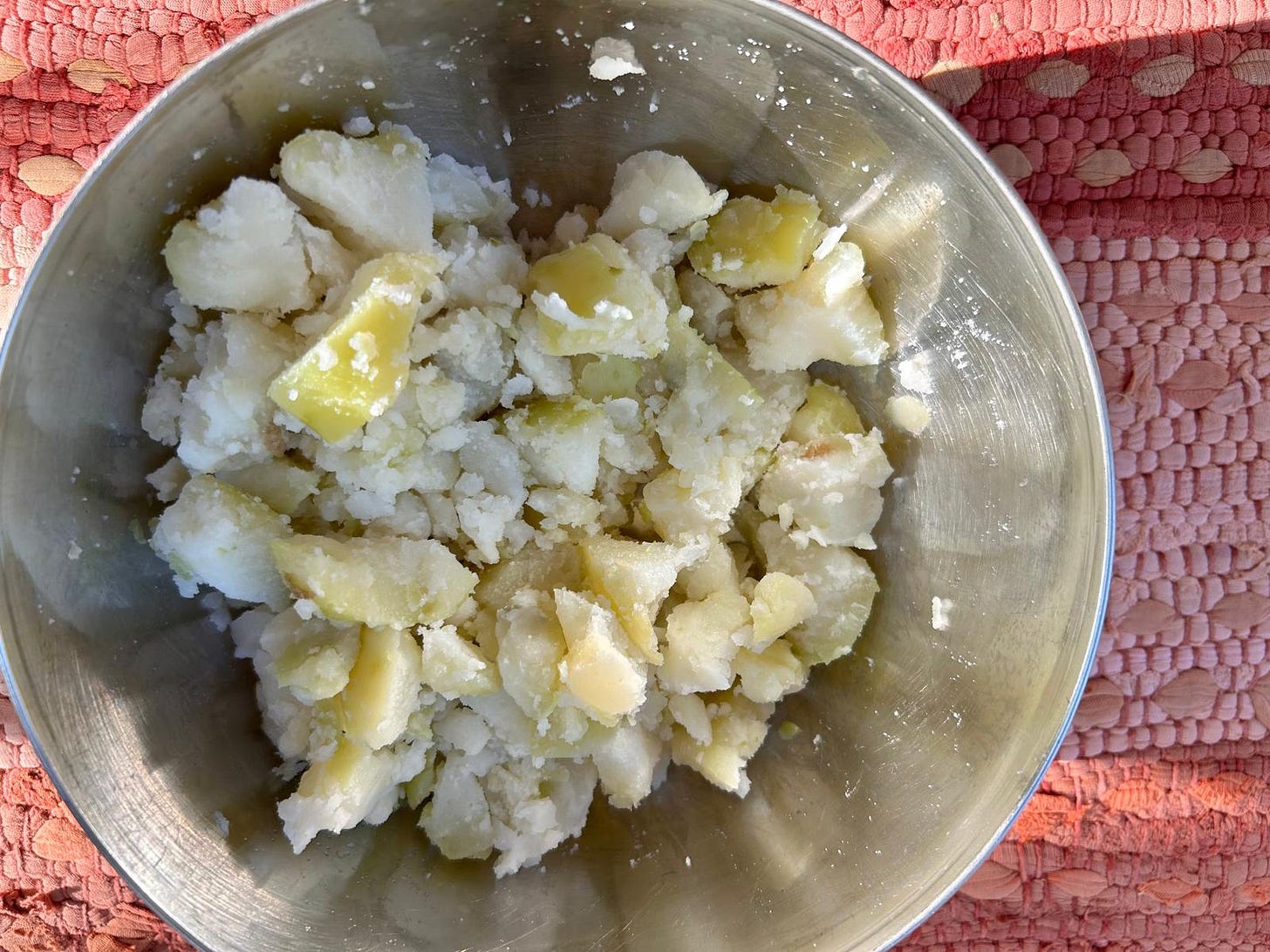 Boiled, peeled, hand-crushed potatoes