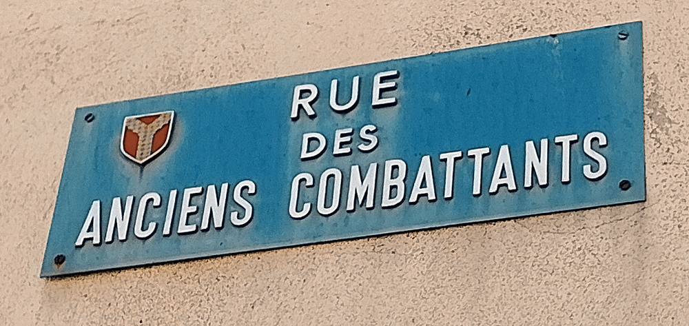 The Rue des Anciens Combattants street sign in Hérépian, 34, France. Image (c) Chris Aspinall, 2024.