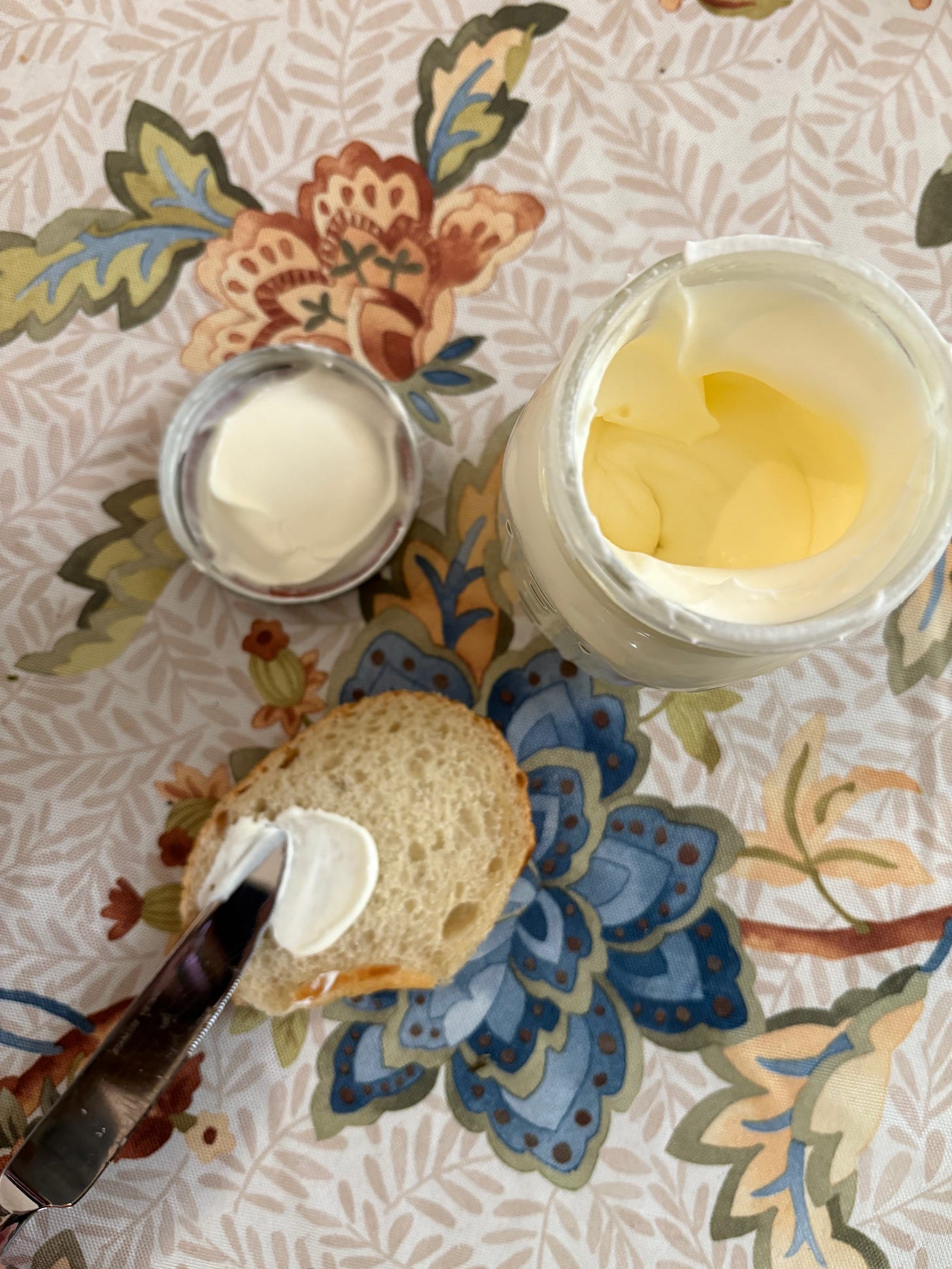 spreading homemade butter on bread