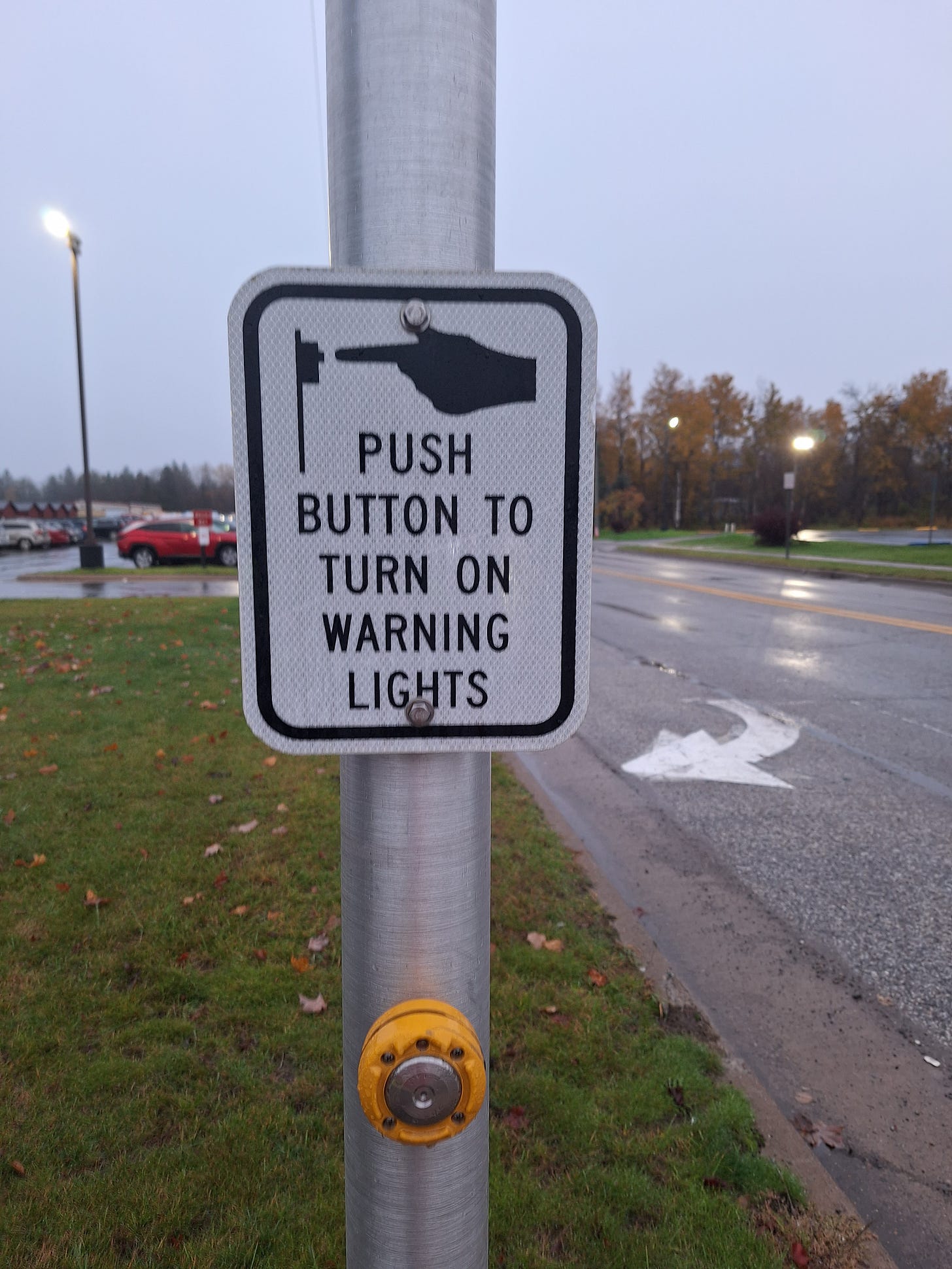 image of a sign that reads push button to turn on warning lights.