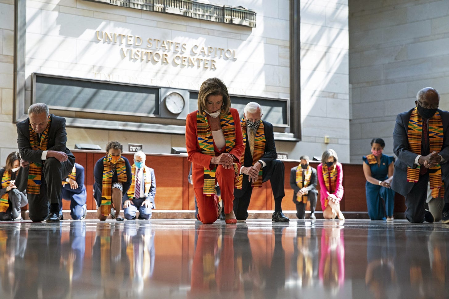 House and Senate Democrats bow their heads during a moment of silence in Emancipation Hall. House and Senate Democrats bow their heads during a moment of silence in Emancipation Hall.