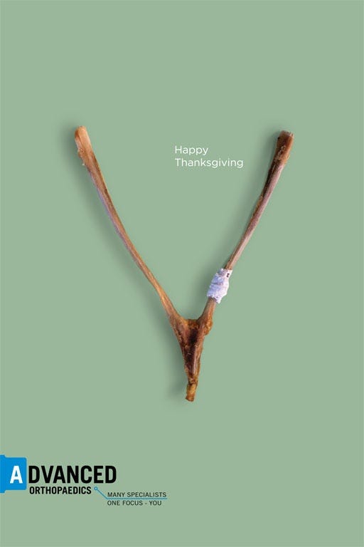 This may contain: an image of the letter v made out of branches with words above it that say happy thanksgiving