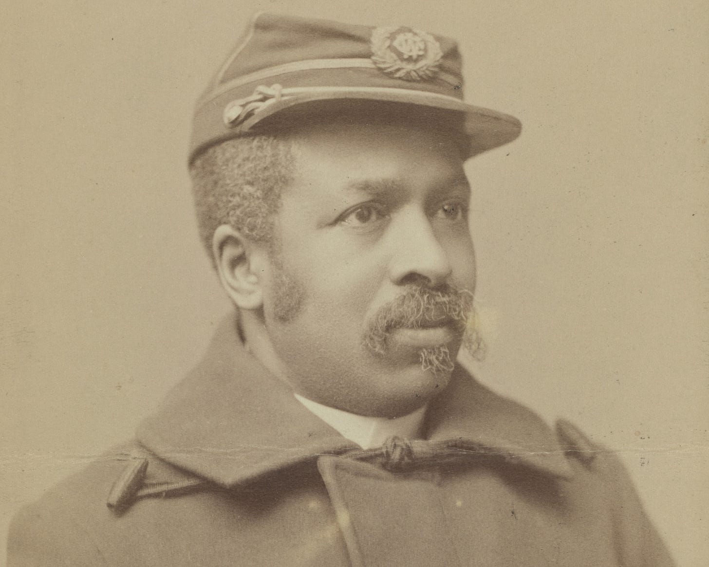 A sepia-toned portrait of Sergeant Major Christian A. Fleetwood, an African American man with a moustache who is dressed in Union Army uniform.