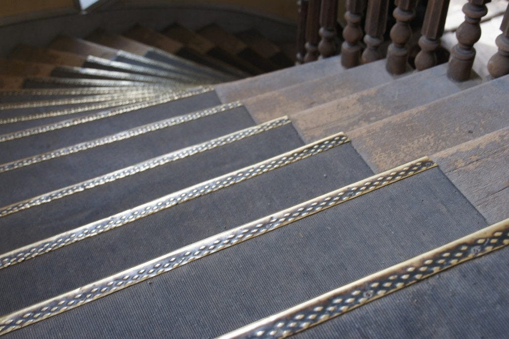 Worn edging on stairs in Bannack's Hotel Meade.