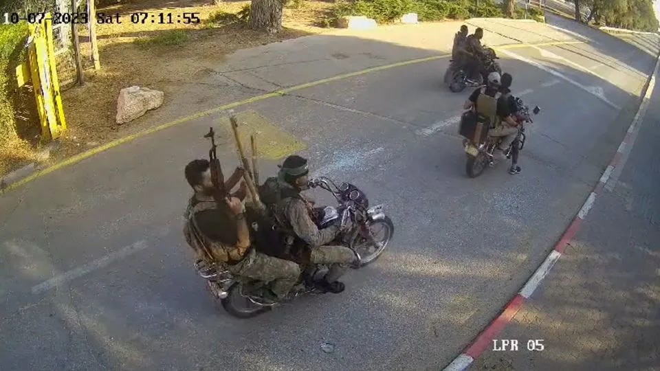 A screenshot from a video, geolocated by CNN, shows six Hamas militants arriving at Be'eri on Saturday morning local time. - Obtained by CNN