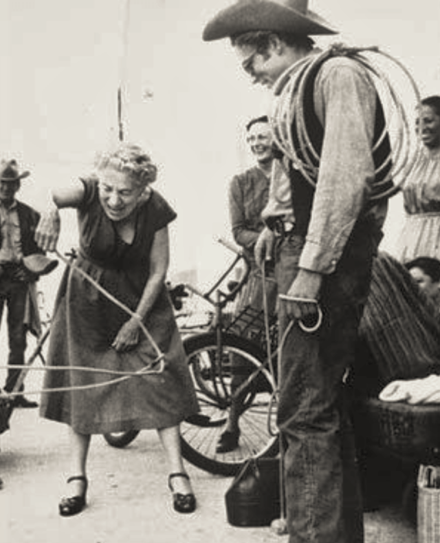 James Dean teaches Edna Ferber a rope trick.