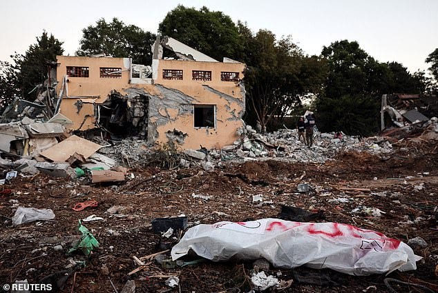 A dead body lies on the ground following a mass infiltration by Hamas gunmen from the Gaza Strip, in Kibbutz Beeri in southern Israel, October 11, 2023