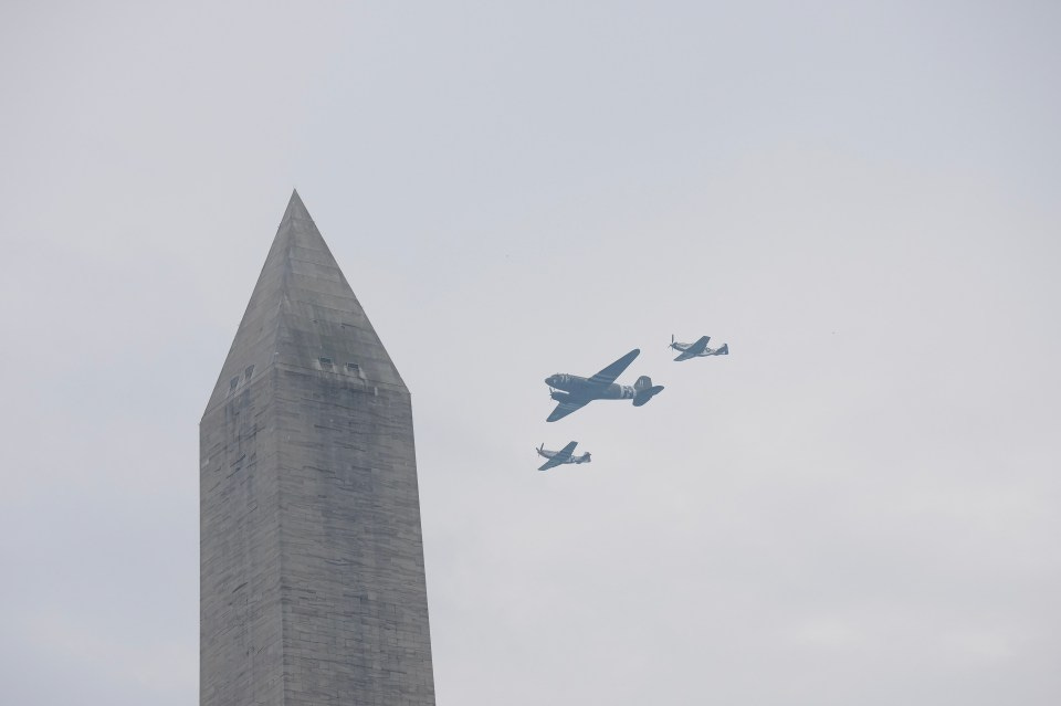 Three airplanes flying past the Washington Monument.