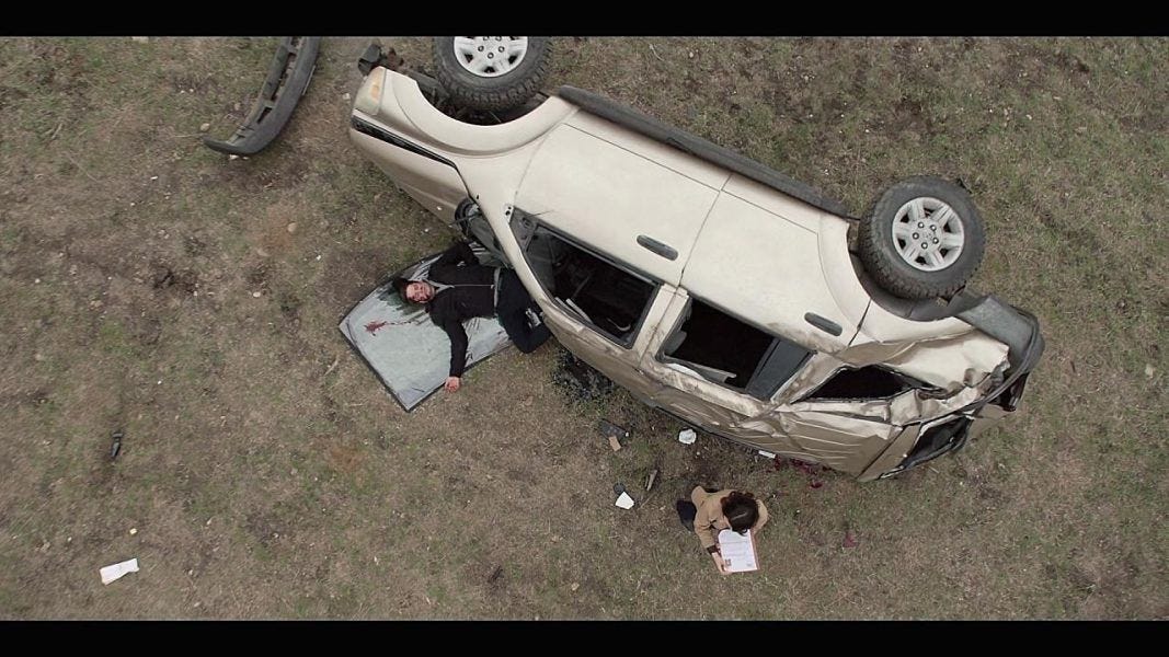 Walker Cassie at crash site with dead man thrown from car 3.11.