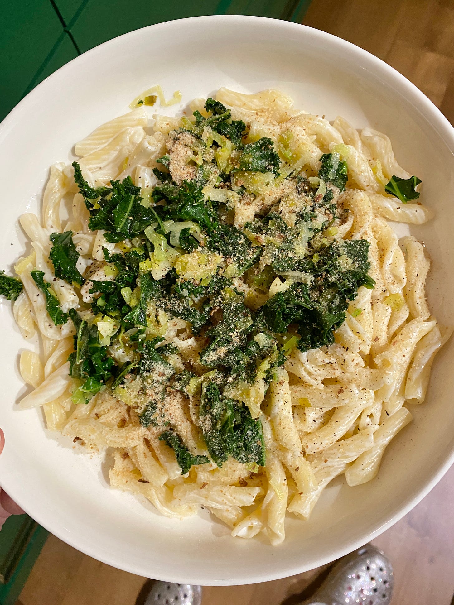 bowl of pasta with a goat cheese sauce, kale, and leeks, made with the recipe below.