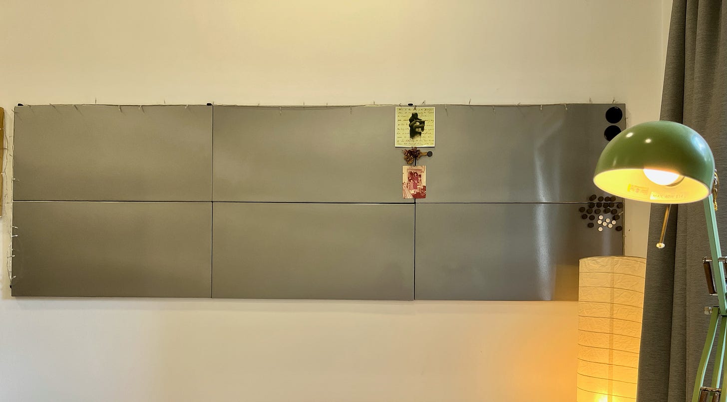 photo of six pieces of blank, grey colour metal memo boards formed into one big memo board