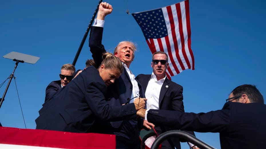 Republican presidential candidate former President Donald Trump is surrounded by U.S. Secret Service agents at a campaign rally, Saturday, July 13, 2024, in Butler, Pa.